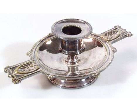 An L Lapan silver plated candlestick, of ecclesiastical Art Nouveau design, with plain circular dish holder and leaf capped h