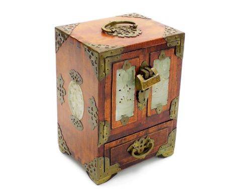 A Chinese hardwood jewellery casket, with brass handle and pierced mounts, carved simulated jade panels, the two hinged doors