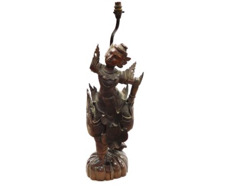 A Thai carved wooden figure of a dancer, on a domed foot, converted to a table lamp (AF), 94cm high overall.