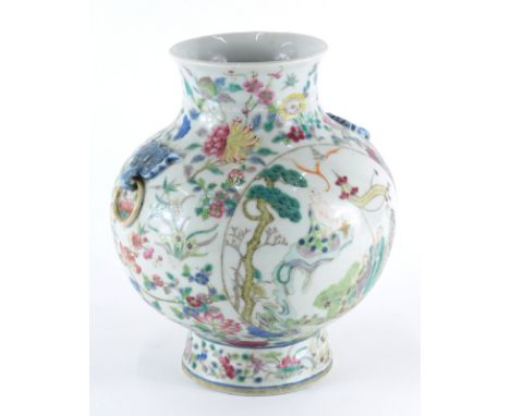 A 19thC Chinese porcelain globular vase, decorated with a selection of flowers and trailing foliage, with applied loop handle