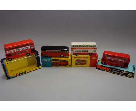 Three tinplate buses and a coach, comprising: Dinky 292 'Leyland Atlantean Bus', boxed; Dinky 295 'Atlantean Bus' Esso, in bu
