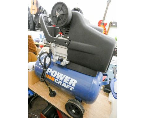 A hardly used Powercraft electric 2.5 horsepower air compressor and a few tools 