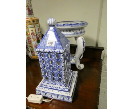 An oriental style blue and white house shaped table lamp and a two tier blue and white jardiniere stand 