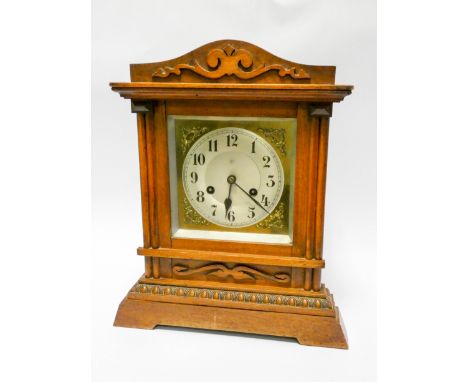 An Edwardian striking bracket clock in walnut case with brass and silver dial 