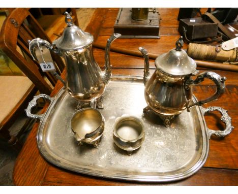 A four piece silver  plated tea and coffee service on a heavy two handled tray 