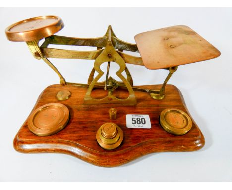 A set of Victorian brass letter scales with weights 