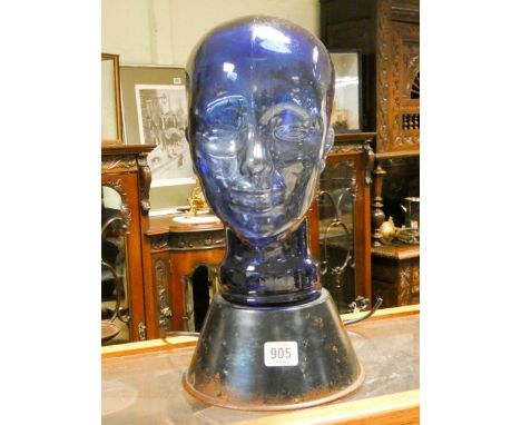 A 1930's light up blue glass skull table lamp on metal base 