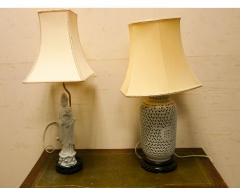 A Chinese style white pierced vase shaped table lamp with shade and a Chinese white figure lamp 