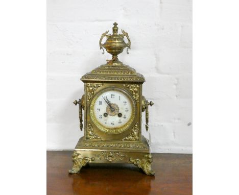 A French striking mantel clock by Japy Freres in decorative brass case with urn shaped finial