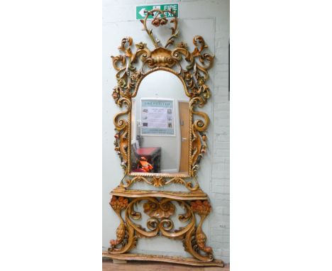 An Italian style highly carved console table and matching mirror all carved with Rococo scrolls and rosebuds, overall height 