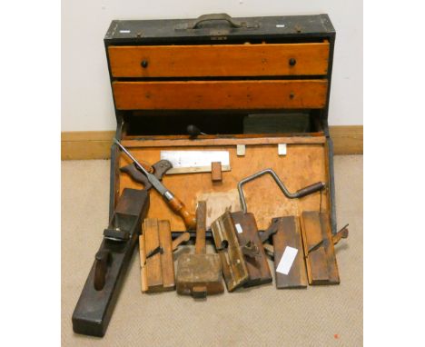 A Victorian fitted carpentry tool chest with interior drawers and a large assortment of carpentry and other tools 