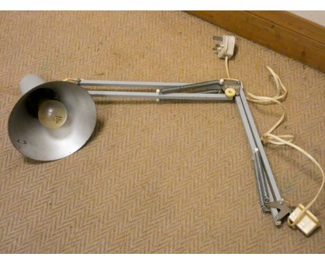 An angle poise wall fixing or desk fixing lamp
