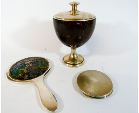 A silver backed hand mirror, ladies compact and a silver mounted coconut shell cup and cover  