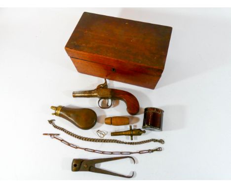 A box lock percussion pistol by Durs Egg of London together with a small copper and brass powder flask, lead shot tongs, chai