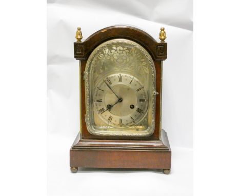 A late Victorian striking bracket clock with arch silver dial in mahogany case 