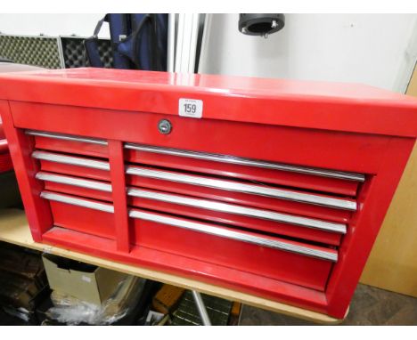 A red tool box with four drawers and lift top lid containing tools 