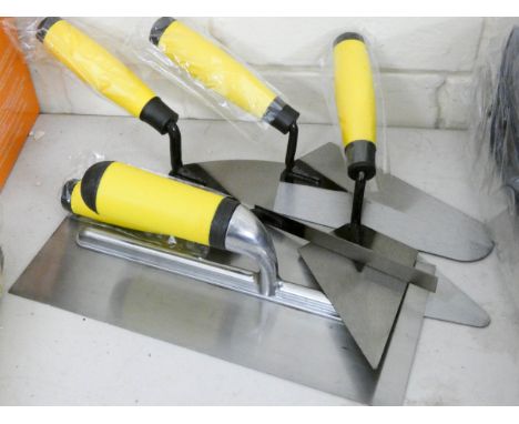 A new five piece plaster and bricklaying trowel set 