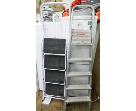 A pair of white hardly used four rung step ladders and an aluminium four rung folding step ladder