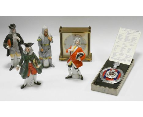 Four porcelain figurines, gilt mantle clock and a Gaunt car badge  
