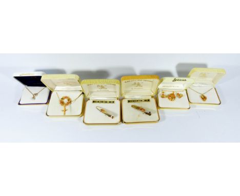 A collection of black hills gold jewellery, some marked 10ct gold some rolled gold comprising pendants, brooch tie clips etc 