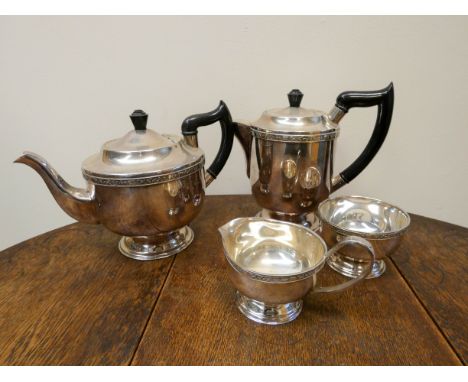 Silver plated tea service comprising teapot, water jug, sugar bowl and milk jug