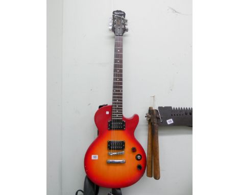 An Epiphone electric guitar   The item appears to be in overall good condition with just a few chips to the body of the guita