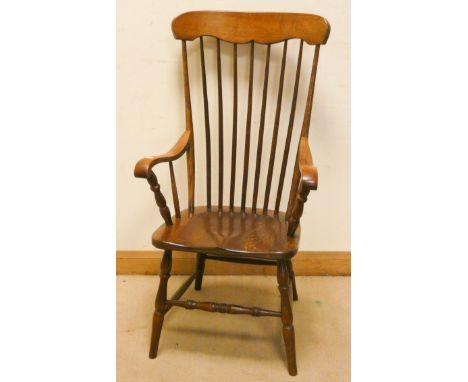 A high stick back oak Windsor style armchair 