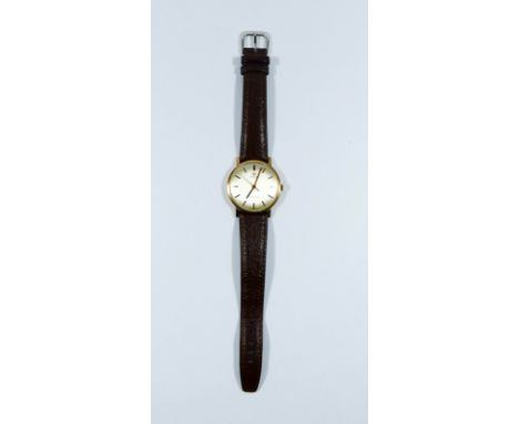 Gents vintage omega Geneve 9ct gold wrist watch with presentation inscription on reverse, brown leather strap  Watch appears 