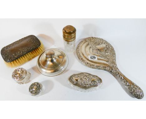 A collection of silver dressing table items to include trinket jars, scent bottle and hand mirror 