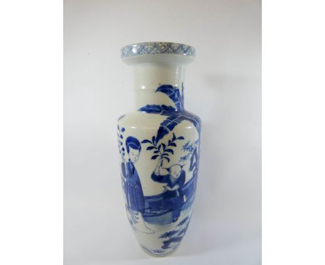 A Chinese blue and white vase decorated with figures in a garden four character mark to base, height 30 cms   There are one o