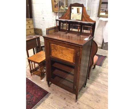 An early 20thc rosewood music cabinet, the superstructure with mirrors and galleried ledge above a door with inlaid panel abo