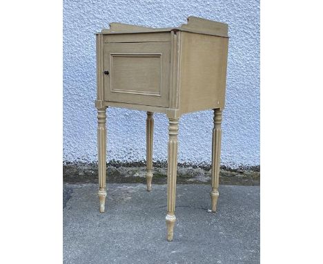 An early 20thc painted bedside table of Regency design, the square moulded top with three quarter gallery edge over a single 