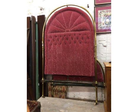 An impressive Edwardian four foot single bedstead, the tubular brass head and footboard with floral velvet upholstered insert