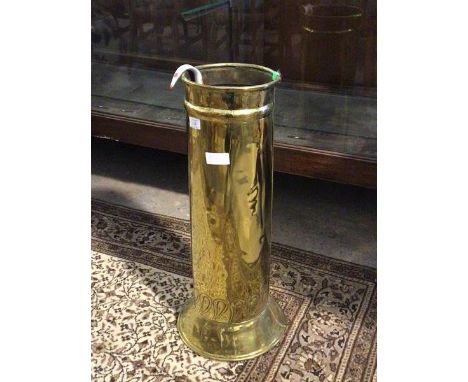 An early 20thc brass cylindrical stick stand, the base with hammered boteh motif, on a splay base (67cm)