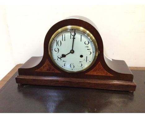 An Edwardian dome top inlaid mahogany cased mantel clock, the white enamelled dial with arabic chapter ring, Westminster chim