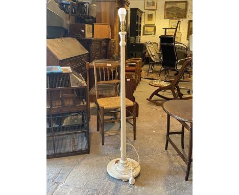 A 20thc white painted floor lamp of classical design, the turned tapering and reeded upright raised on a stepped square base 