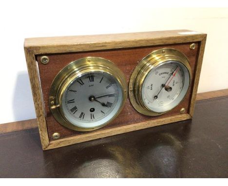 A Sestral ship's bulkhead type clock together with a Sestral aneroid barometer,  both mounted on a hardwood test case (17cm)