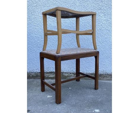 An Edwardian mahogany stool in the Georgian taste, the floral upholstered drop in seat pad above square chamfered supports un