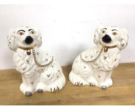 A pair of Beswick chimney spaniels, one with a Beswick stamp to base (26cm)