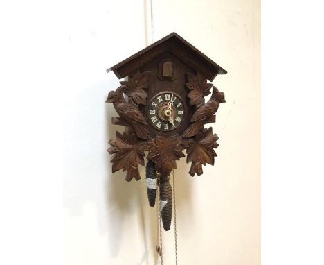 A 20thc West German cuckoo clock striking the hours and halves hammer on coil