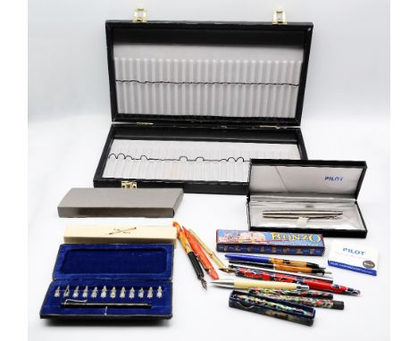 A collection of Decorative pencils, calligraphy pens and ballpoint pens including vintage boxed mottled Conway Stewart "The D