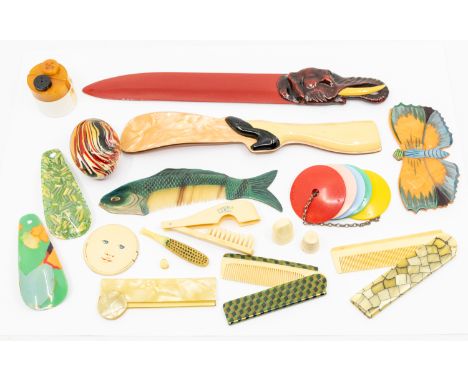 A small collection of mid 20th century bakelite items to include; a novelty butterfly shaped comb case with removable comb, w