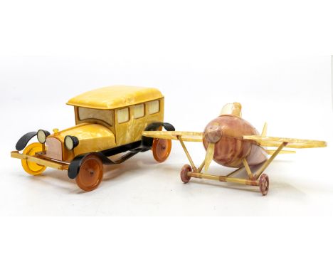 A novelty mid 20th century bakelite / celluloid model of a classic car, pearlized yellow colourway with black wheel arches, a