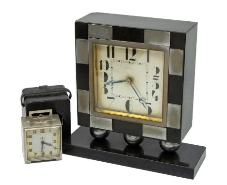 An Art Deco designed 8 day mantel clock, having stylish silver and black mixed colourway square face surround, Deco designed 