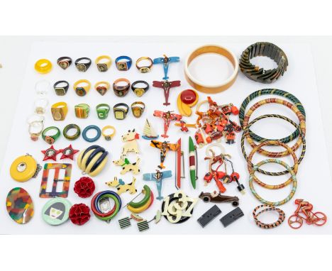 A collection of mixed bakelite, celluloid and similar jewellery to include; a stylish 70s/80s geometric dark green stretch br