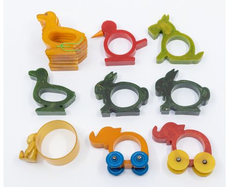 A collection of mixed vintage / retro 20th century bakelite napkin rings, all of novelty designs to include; a single bird sh