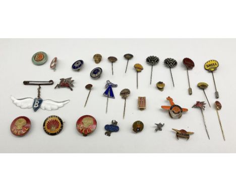 Assorted automobile related gilt metal and enamel badges two unnamed Shell gilt brass and red enamel lapel badges with yellow