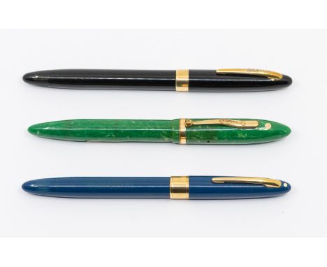 Three fountain pens to include: a vintage Sheaffer Jade green mottled Lifetime lever fill fountain pen, the cover with white 