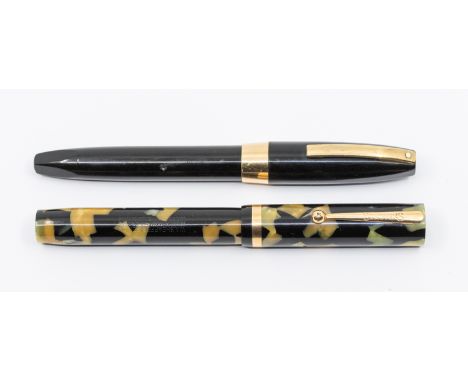 Two vintage Sheaffer fountain pens to include: 1. a Sheaffer Lifetime flat top fountain pen, the barrel and cover black and p