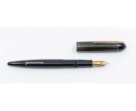 Henry Dreyfuss: a vintage Eversharp Skyline fountain pen, circa 1940s, with midnight blue barrel and cover with blue top abov
